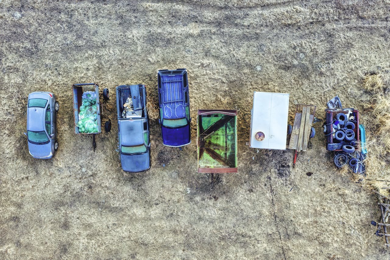 services-03 Bird's-eye view of multiple parked vehicles and trailers on a rural area in Minnesota, USA.